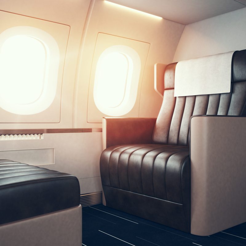 Interior,Of,Luxury,Airplane.,Empty,Leather,Chair,,Sunlight,Illuminator.,Horizontal